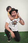 Man wearing white Chicken Adobo Philippine sun graphic tee with child on shoulders – Filipino streetwear by Spam Loves Rice