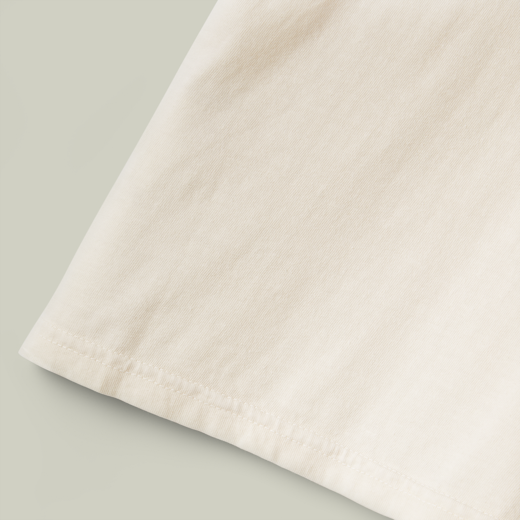 Close-up of beige fabric on a light gray background
