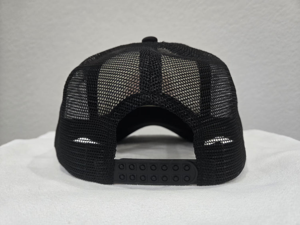 Back view of black curvebill trucker hat with mesh snapback - Rice and Revenge by Spam Loves Rice