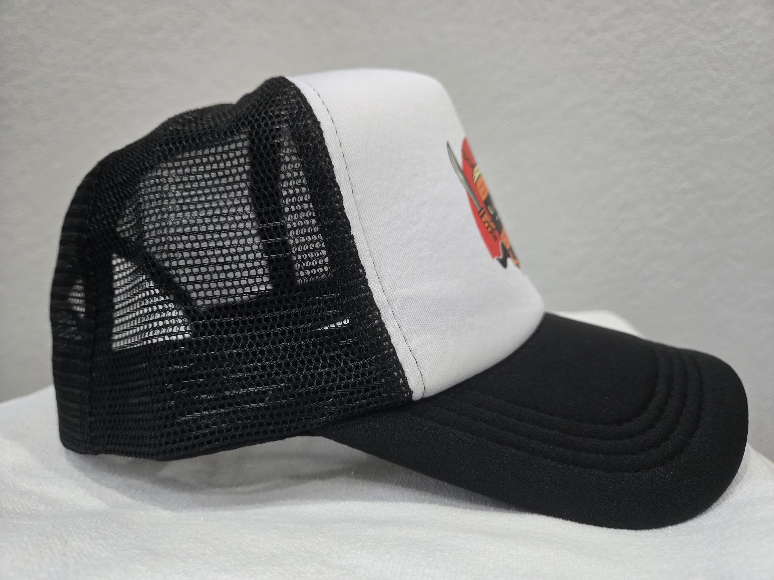 Side view of black and white Rice and Revenge curvebill trucker hat2 – Filipino streetwear by Spam Loves Rice
