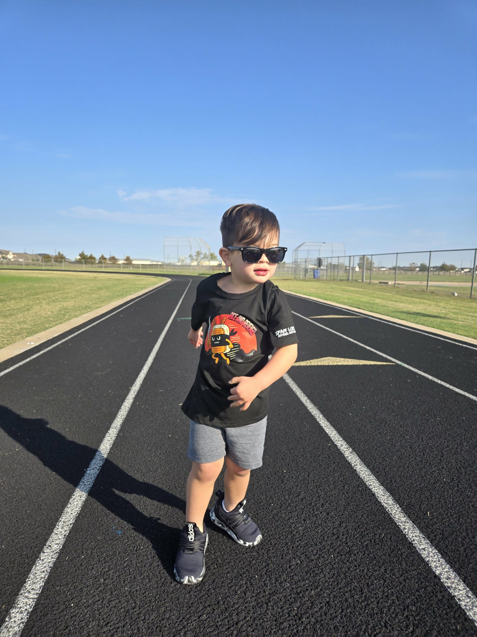 Toddler wearing black Rice and Revenge graphic tee – Filipino streetwear kids by Spam Loves Rice