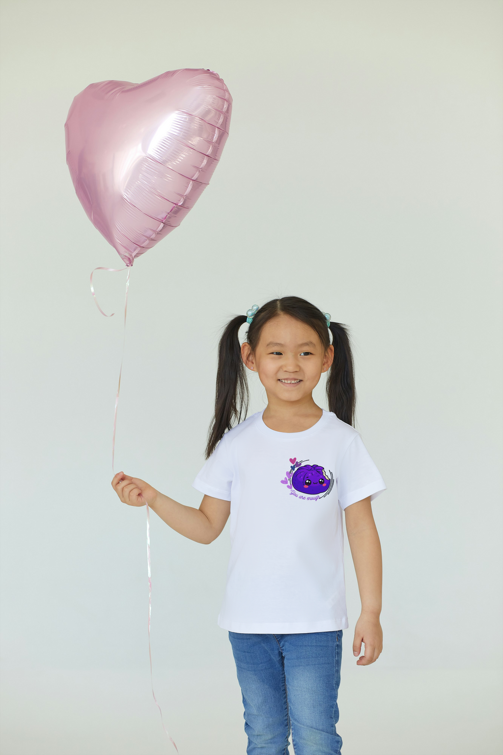Girl wearing white You Are Enough kawaii siopao graphic tee front view with balloon– Filipino streetwear kids by Spam Loves Rice